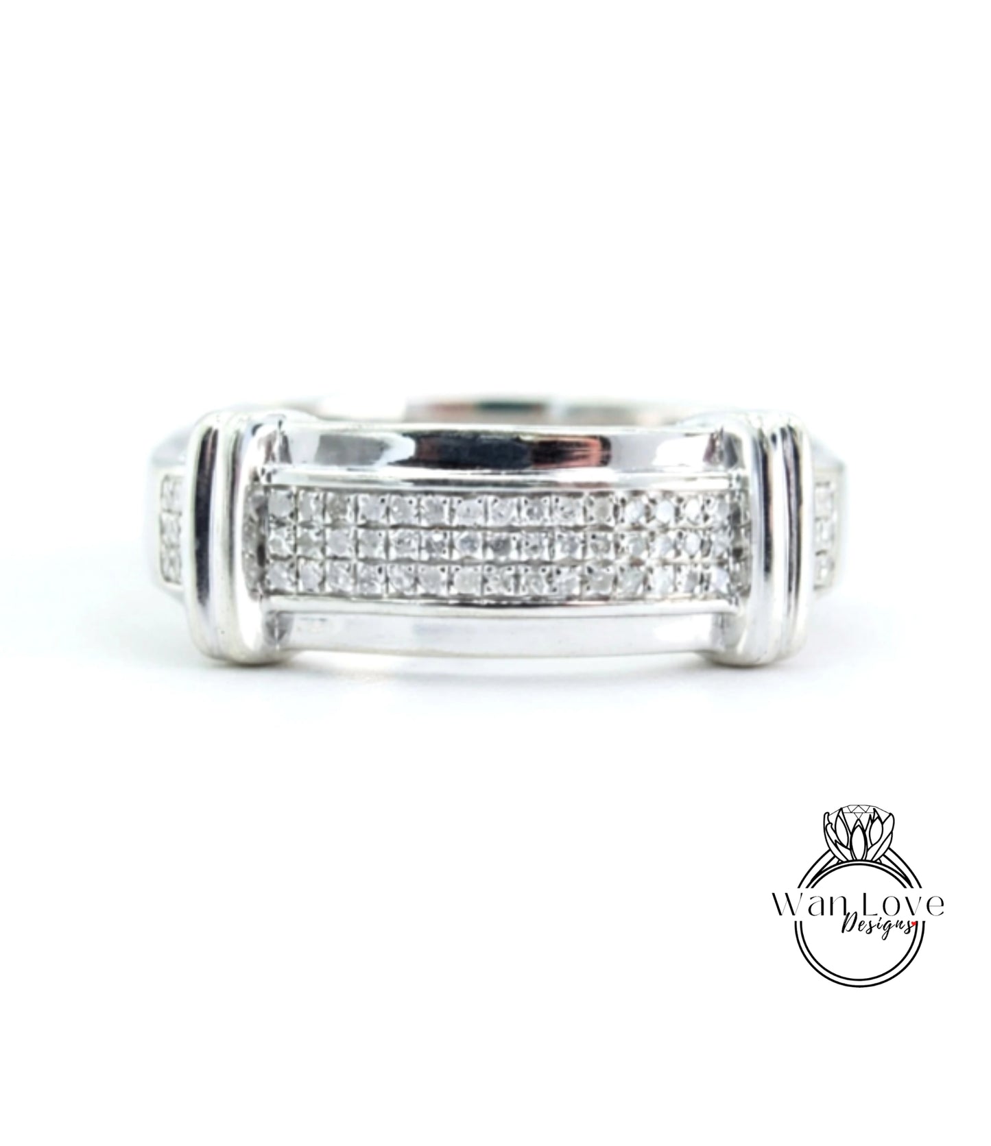 A silver ring with a row of small diamonds set in the band.