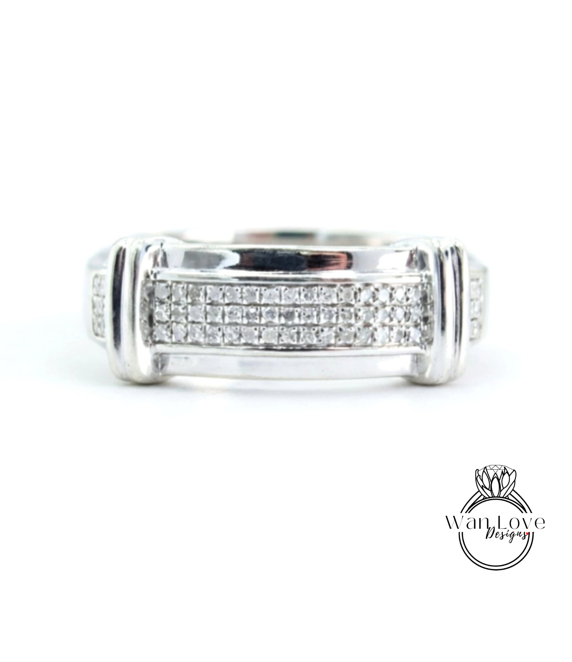 A silver ring with a row of small diamonds set in the band.