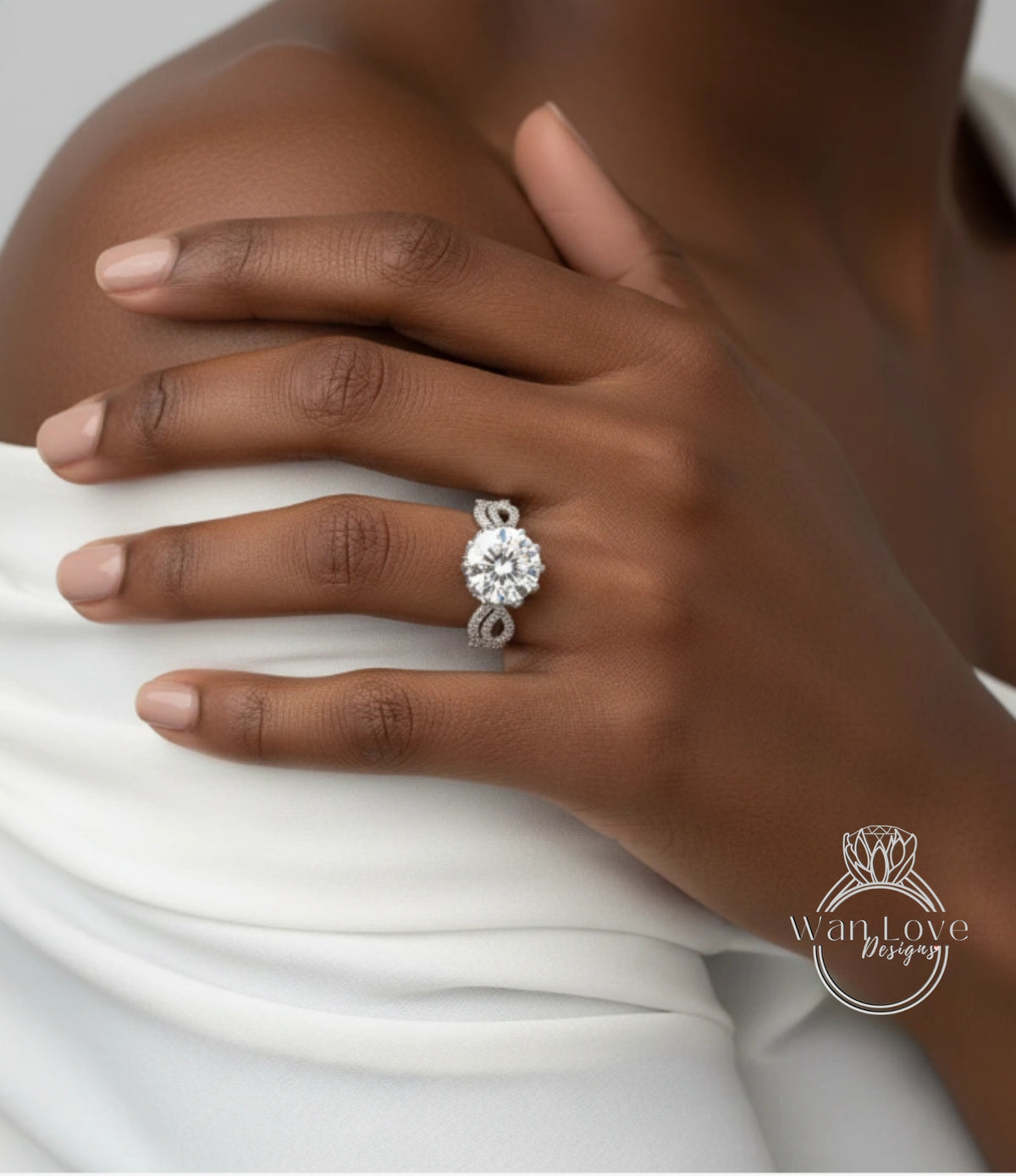 A close-up of a person's hand wearing a large diamond engagement ring.
