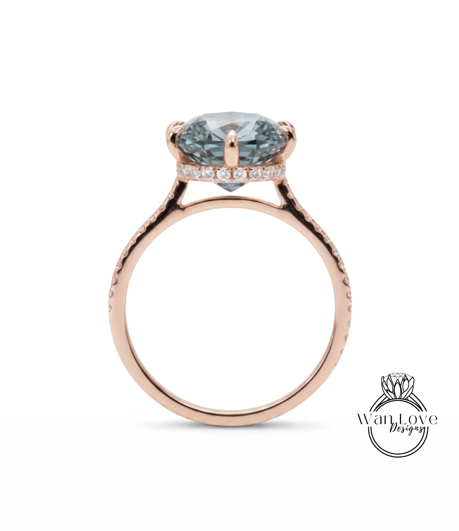 A rose gold engagement ring with a large blue gemstone set in the center, surrounded by smaller diamonds.