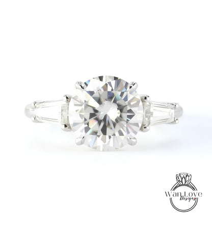 A close-up of a diamond engagement ring with a large, brilliant-cut diamond set in a silver band.