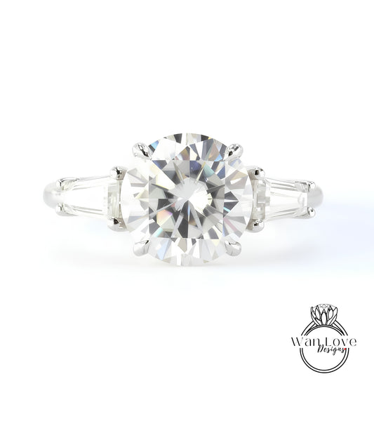 A close-up of a diamond engagement ring with a large, brilliant-cut diamond set in a silver band.