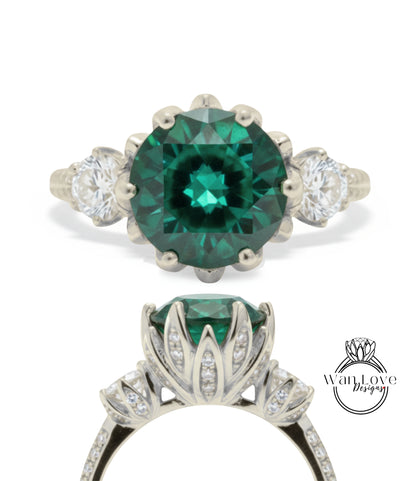 A stunning engagement ring with a large, vibrant green gemstone set in a silver band, surrounded by smaller diamonds.