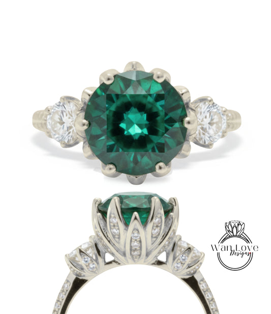 A stunning engagement ring with a large, vibrant green gemstone set in a silver band, surrounded by smaller diamonds.