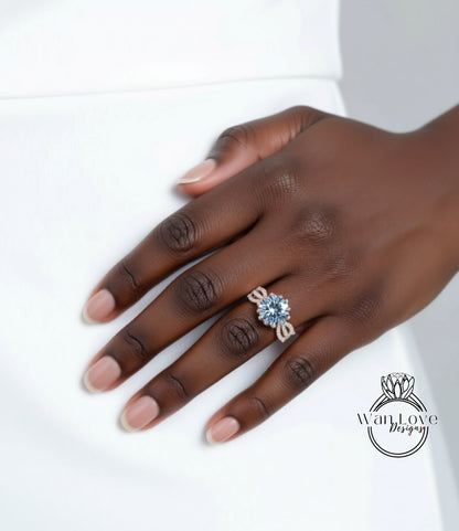 A close-up of a hand wearing a large diamond ring on the ring finger.