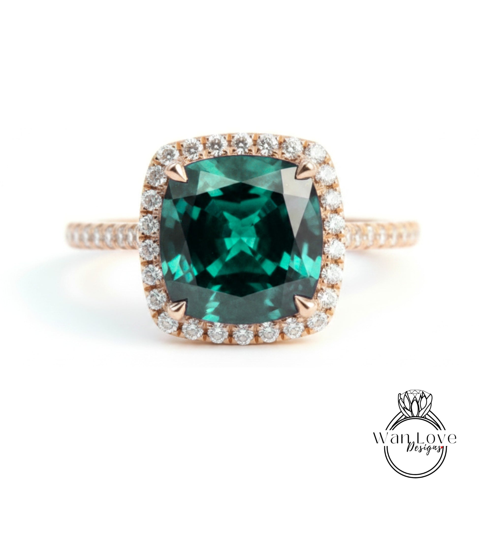A large, square-cut green gemstone set in a gold ring with a halo of smaller diamonds around the edge.