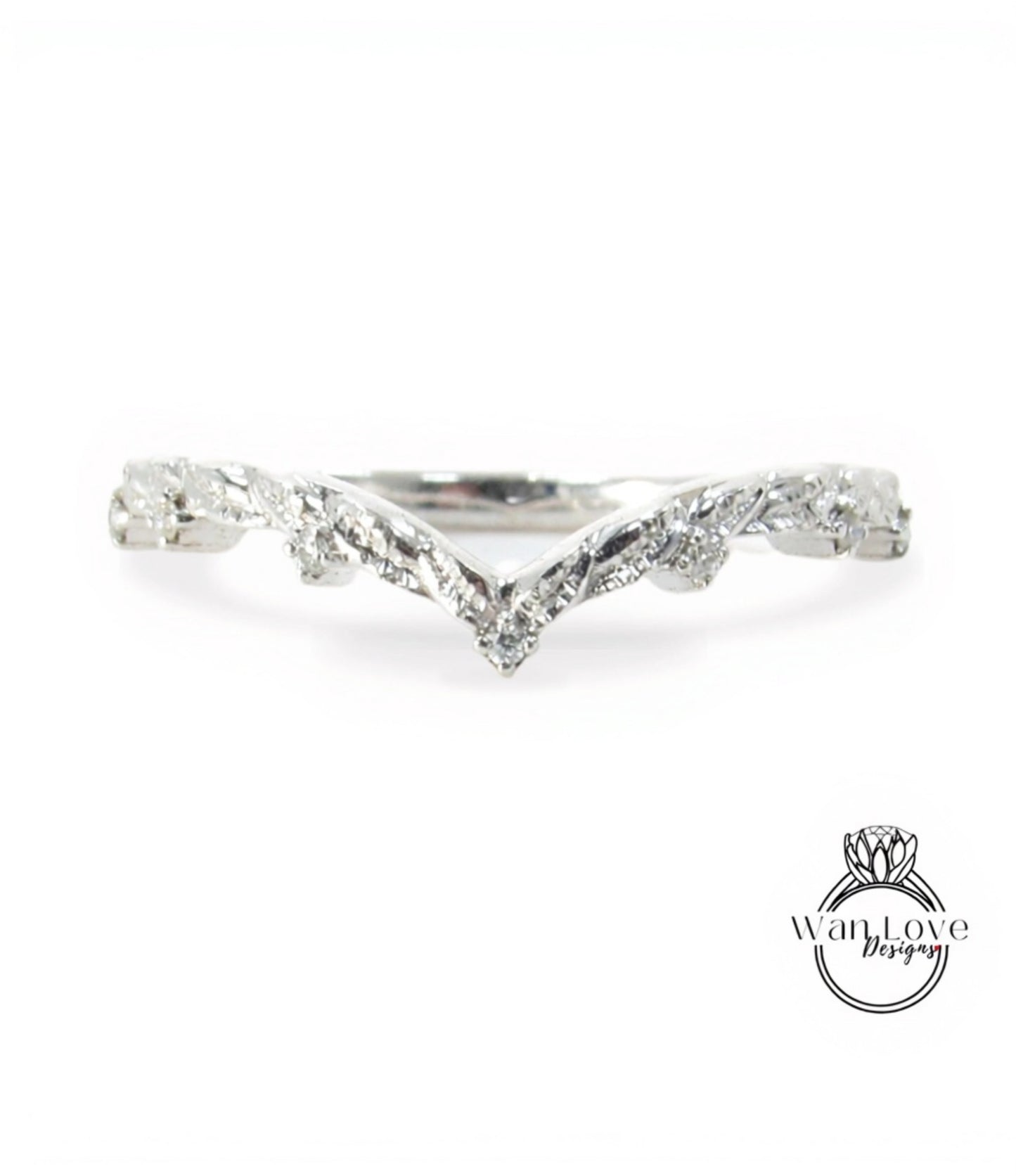 A silver ring with a v-shaped design and small diamonds.