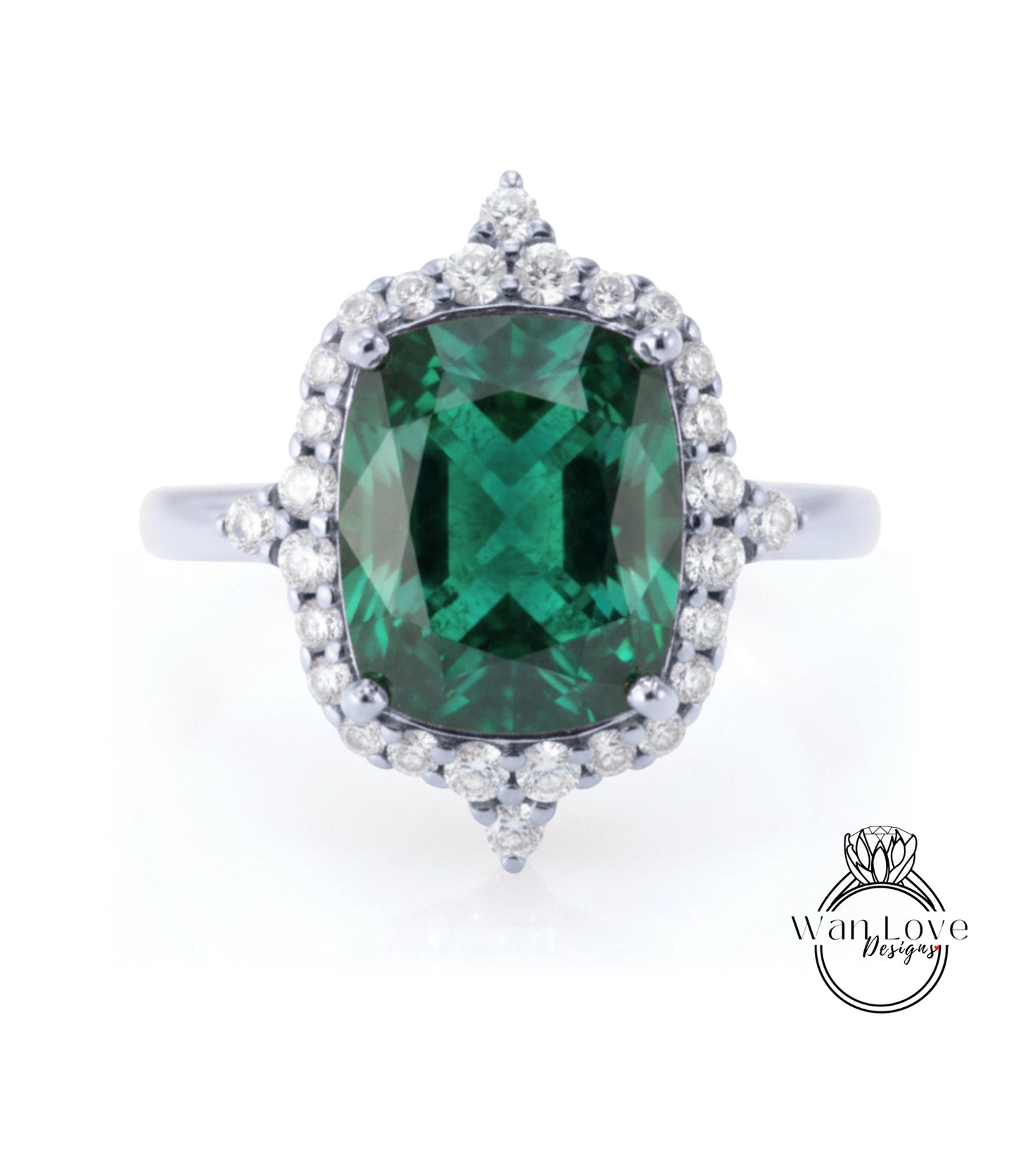 A large, oval-shaped green gemstone set in a silver ring with a halo of smaller diamonds around it.