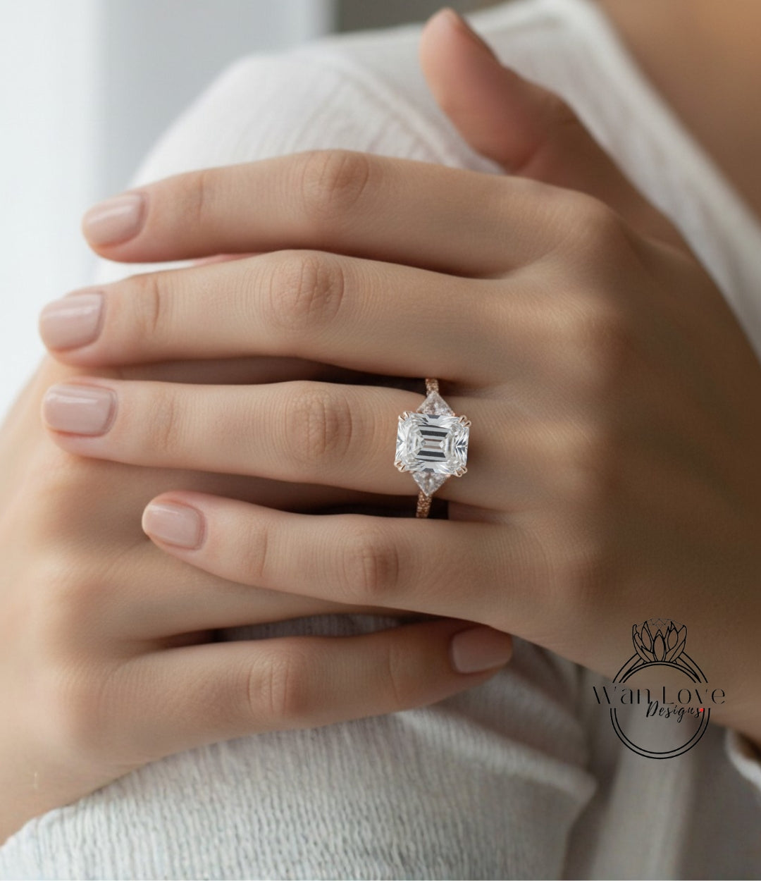 A close-up of a person's hand wearing a large, diamond-encrusted engagement ring.