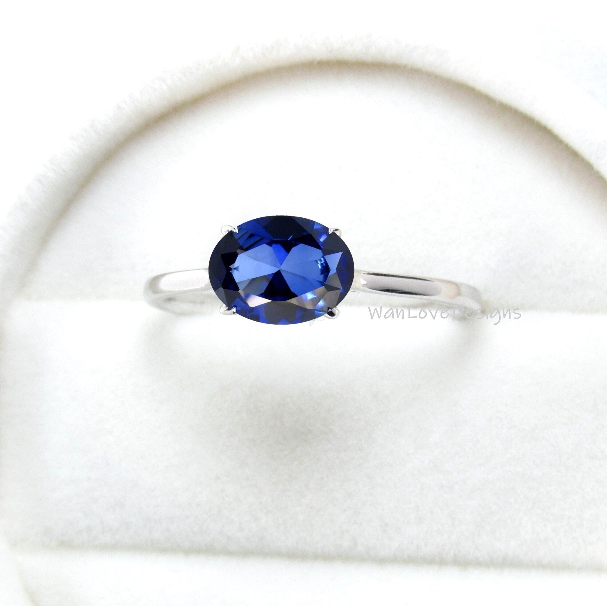 oval blue sapphire ring, blue sapphire engagement ring, east west setting, oval cut sapphire ring Wan Love Designs