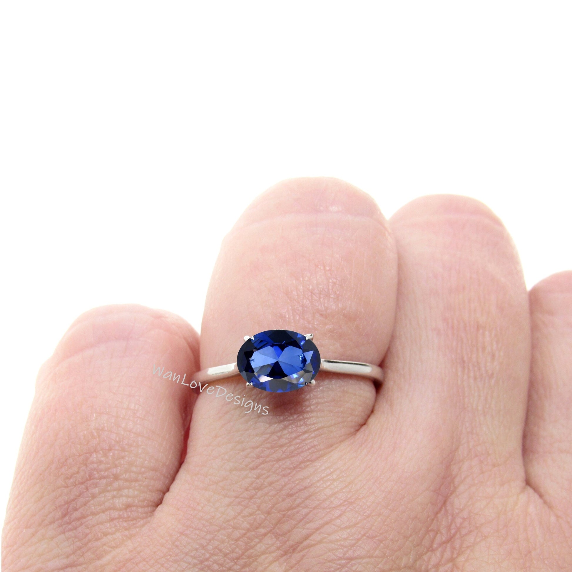 oval blue sapphire ring, blue sapphire engagement ring, east west setting, oval cut sapphire ring Wan Love Designs